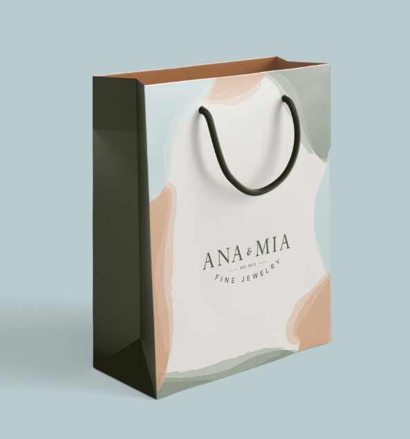 Image of shopping bag with ana and mia logo on it